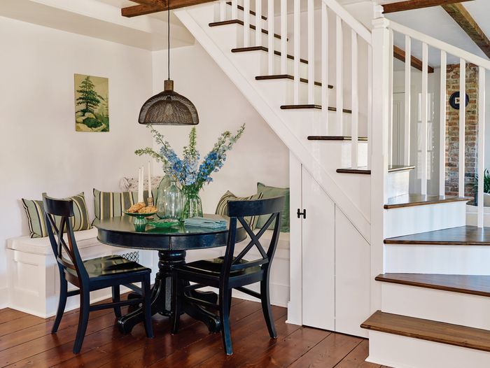 Dining nook on the side of the house stairs