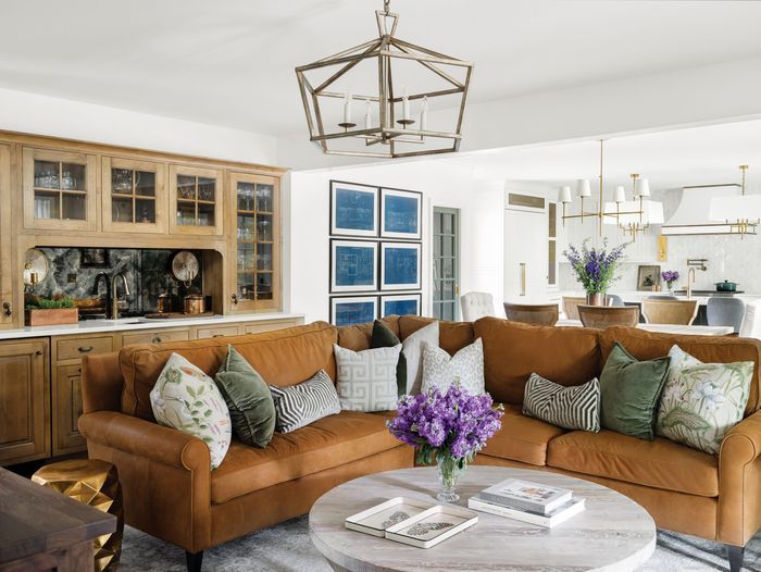 Living room with a leather couch and marble table