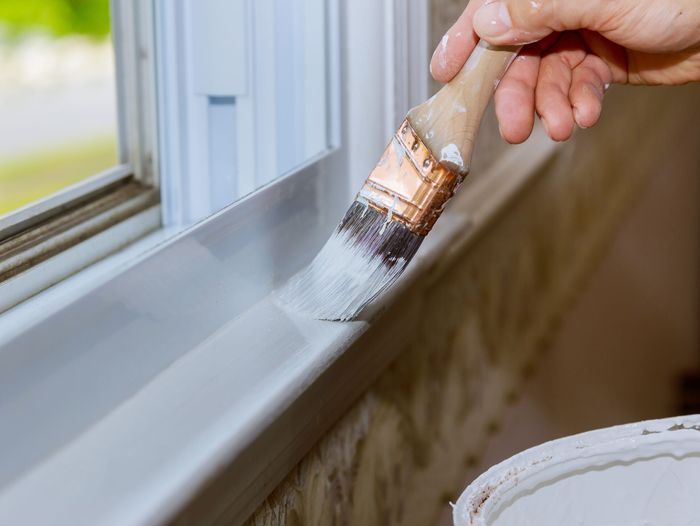 Painting trim of a window